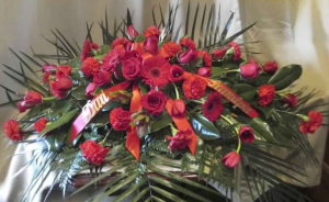 Casket Spray with Roses, Carnations, Large Gebera Daisy, and Tulips
