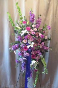 Easel Spray with Bells of Ireland, Stock, Asiatic Lilies, Carnations, Miniature Gerbera Daisy and Alstroemeria