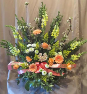 Traditional Tribute with Snapdragons, Large Gerbera Daisy, Roses, Alstroemeria, Pom Mums and Solidaster