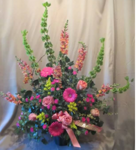 Traditional Tribute with Bells of Ireland, Snapdragons, Large Gerbera Daisy, Roses and Asters