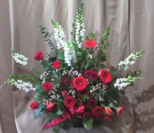 Traditional Tribute with Snapdragons, Roses, Large Gerbera Daisy, Pom Mums, Tulips* and Waxflower