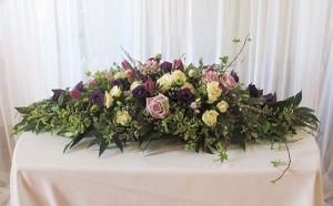 Floral Table Arrangement with Lavender and Ivory Roses, Lisianthus, Tulips, and mixed greens