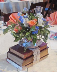 Book and Tea Cup Centerpiece with Pink Mini Rose, Blue Delphinium and Babies Breath 