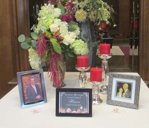 Remembrance Table with Vase of Hydrangea, Roses, Stock, and Mixed Greens